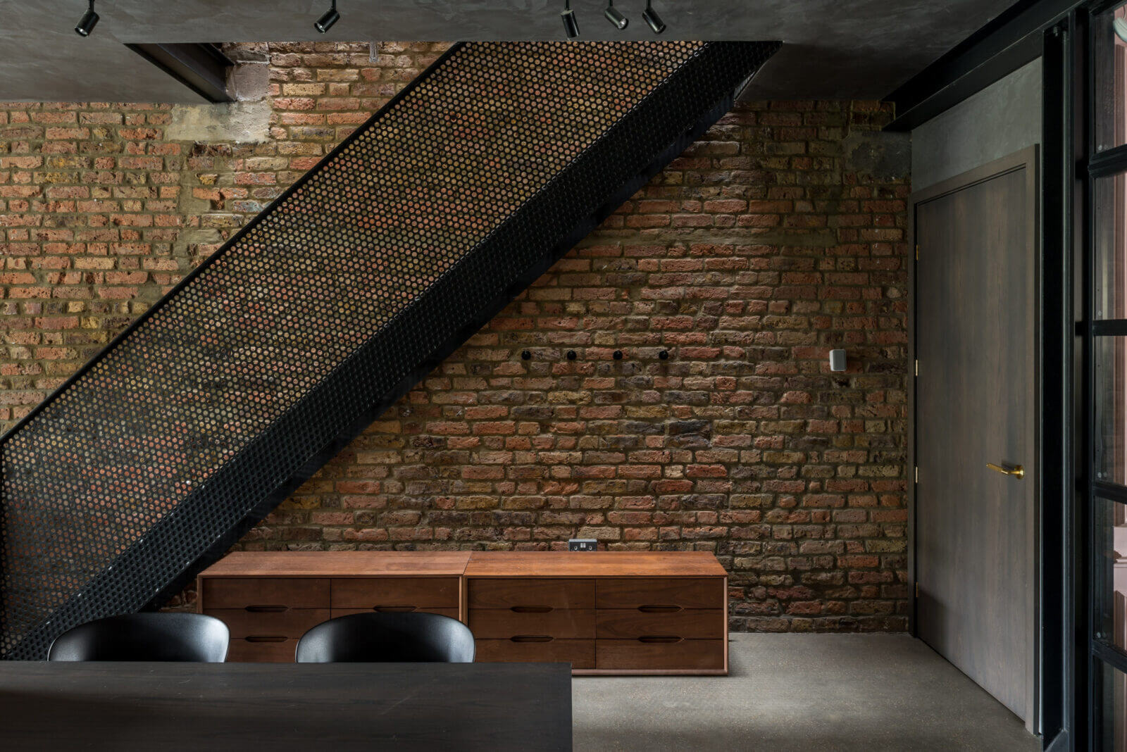 Exposed brick on staircase